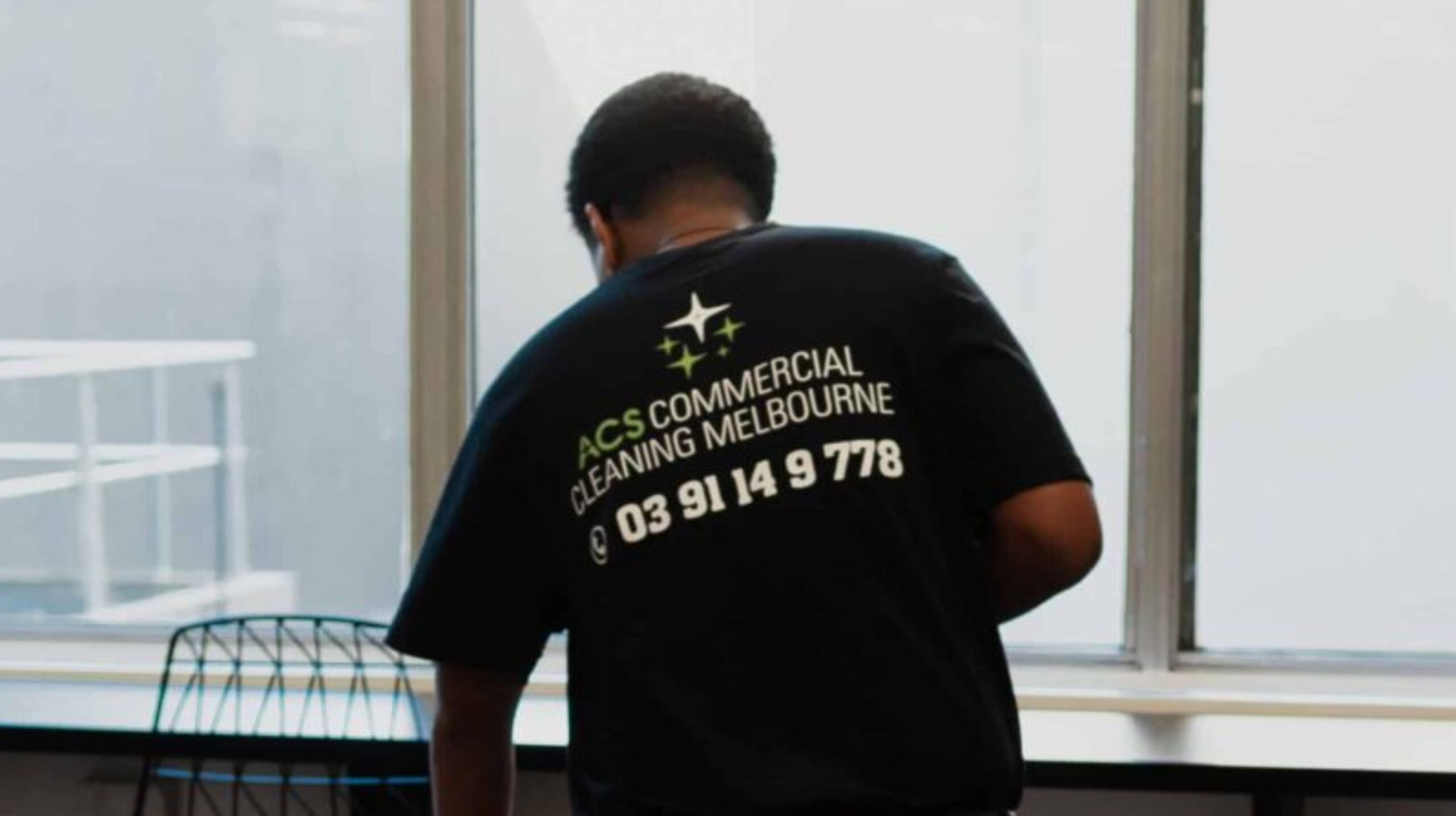 Cleaner cleans office on behalf of ACS Commercial Cleaning company